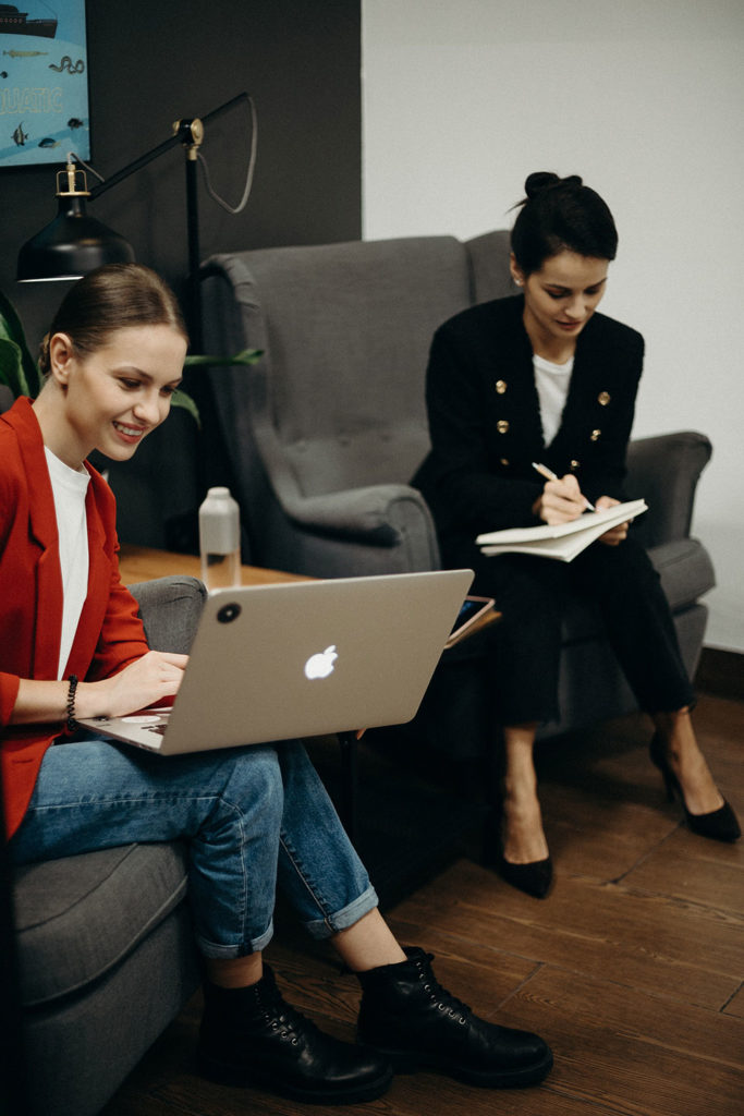 businesswomen with laptops in the office