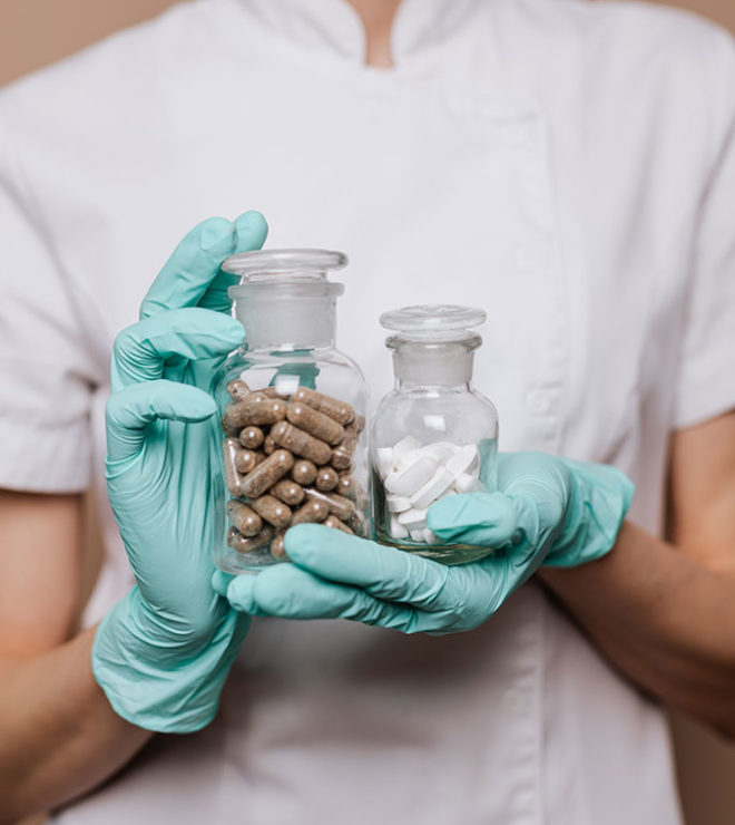 health digital marketing nurse in gloves holding bottle with pills